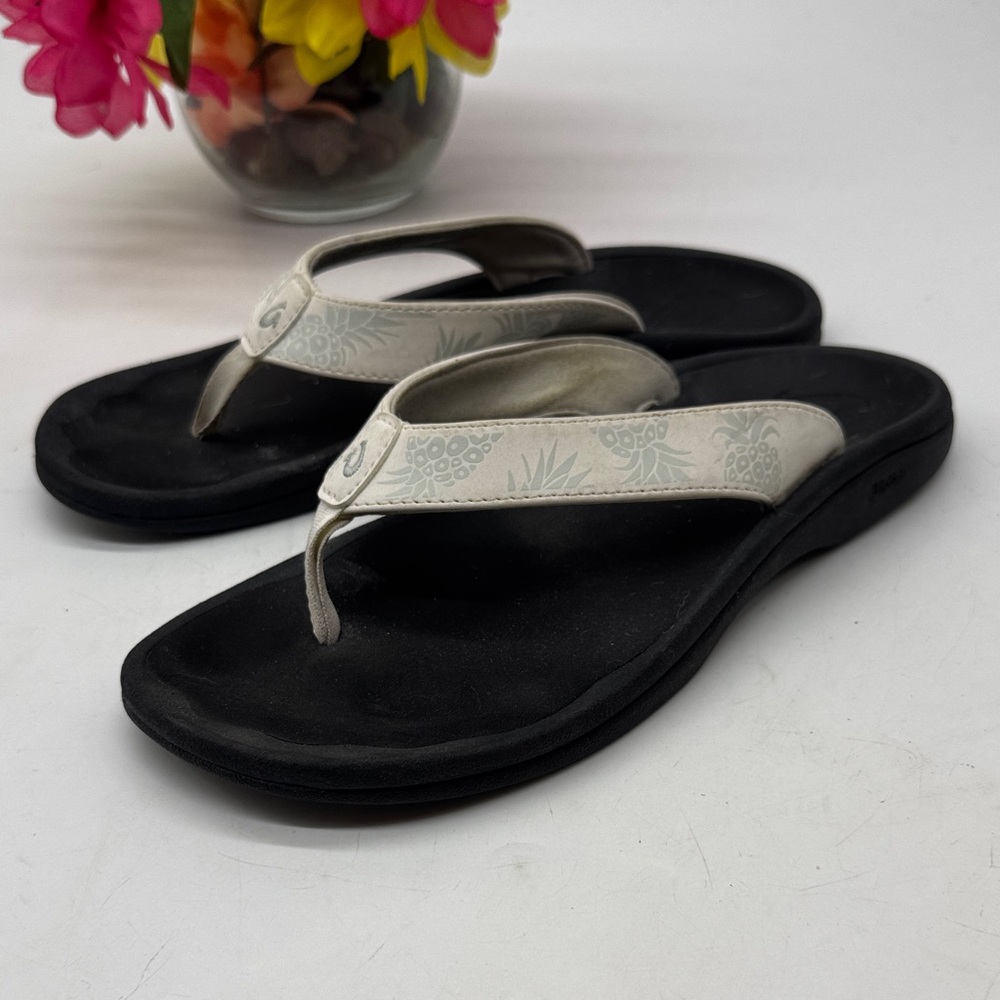 OluKai Women's Black Flip Flop Sandals with White Floral Straps FFT9520A